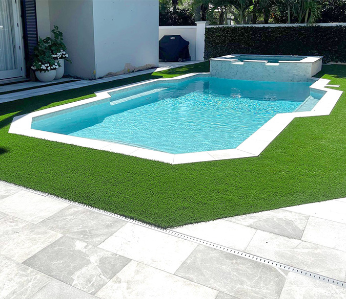 Synthetic turf around a Palm Beach Gardens, FL home pool