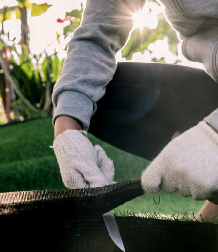A Professional Completing a Turf Installation at a West Palm Beach, Florida Home
